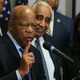 Rep. John Lewis (D-Ga.) speaks about Hillary Clinton Feb. 11, 2016, while flanked by members of the Congressional Black Caucus during a news conference at the Democratic National Committee headquarters in Washington, D.C.
Mark Wilson/Getty Images